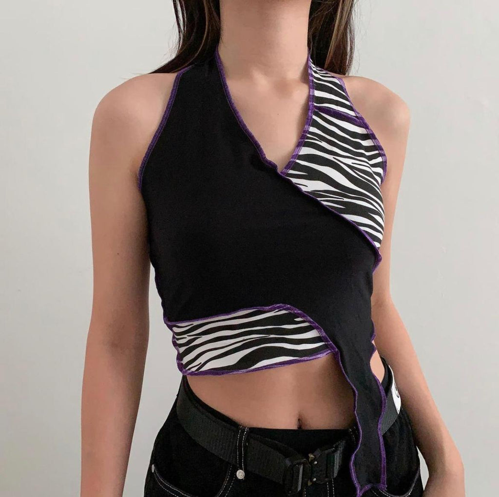 Black and zebra print top stitched together with purple raw hem thread