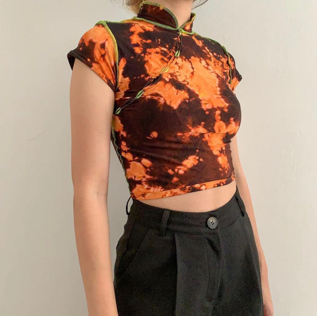 brown bleached orange cheongsam cut lined with green thread 